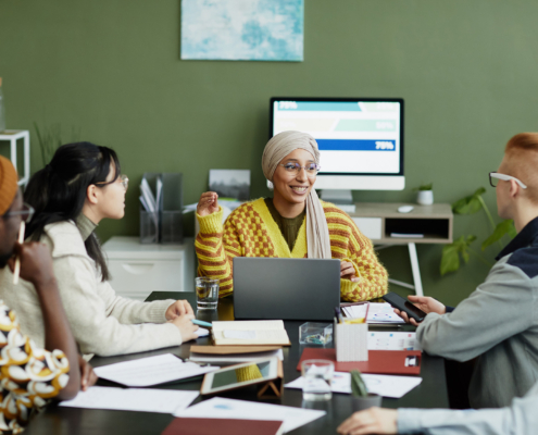 It Technicians Having Meeting In Conference Room
