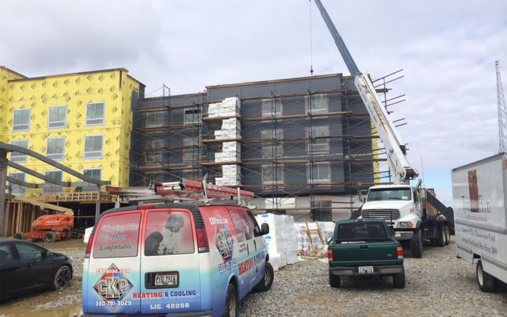 Ckp Truck In Front Of New Construction Residential Building