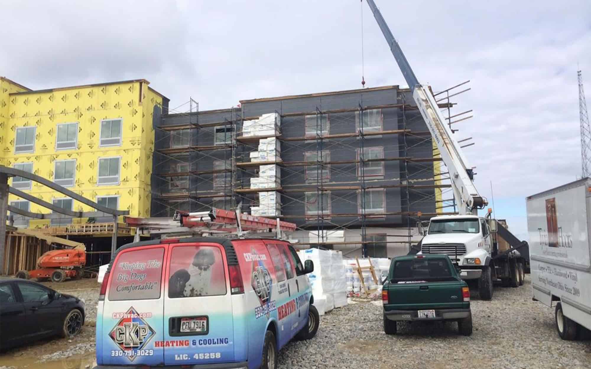 Ckp Truck In Front Of New Construction Residential Building