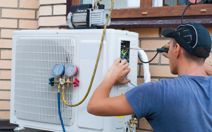 Ckp Technician Performing Maintenance On Residential Hvac Unit