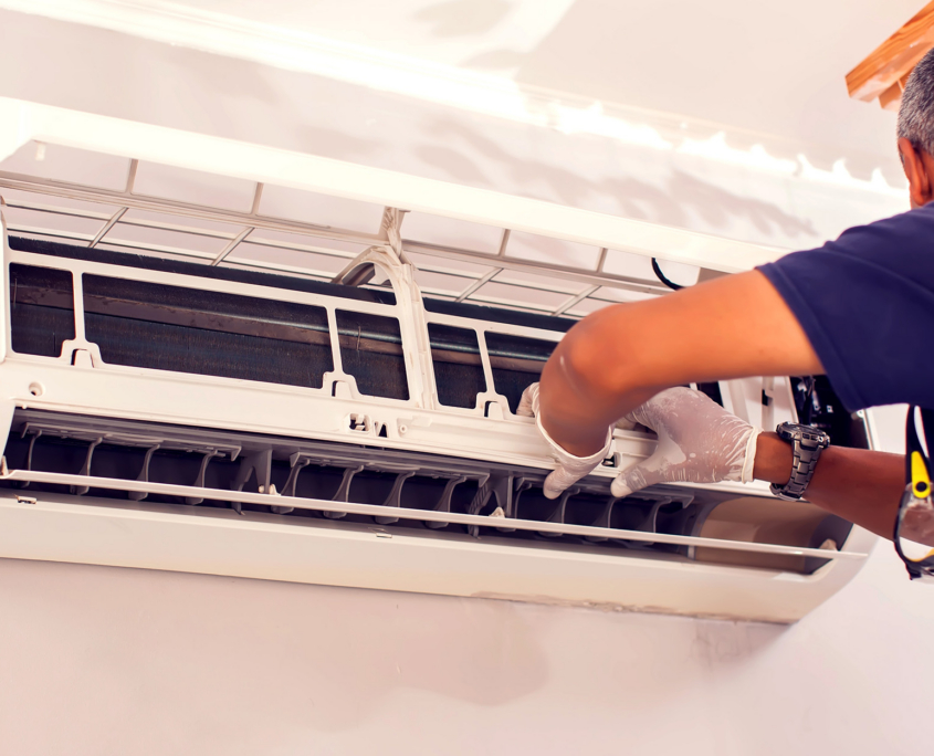 Worker Installing Ac In Home