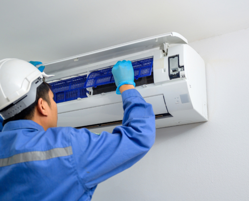 Worker Looking At Ac Unit